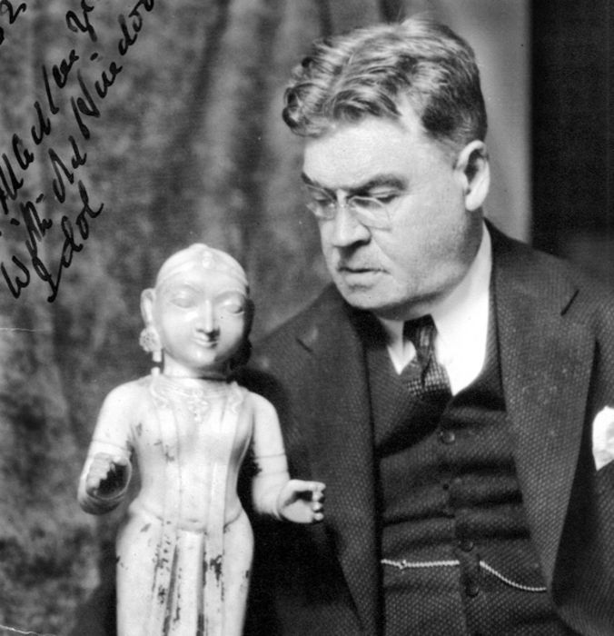 Norman MacKenzie with a Hindu statuette, July 1932